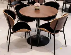 This Modern Three-Seater Dining Set Features a Round Light-Wood Table
