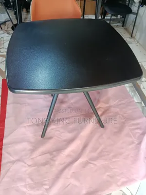 Imported Black Square Table With Angled Legs and a Smooth Top