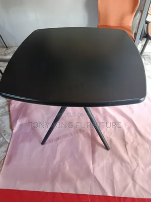 Imported Black Square Table With Angled Legs and a Smooth Top