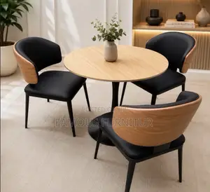 This Modern Three-Seater Dining Set Features a Round Light-Wood Table