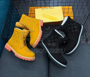 *Louis Vuitton Ankle Boots With a Monogram-Design and Chunky
