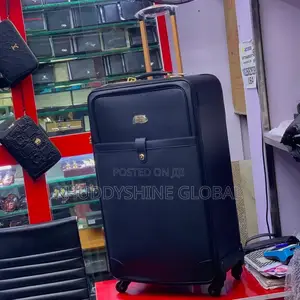 Black Leather Trolley Suitcase With a Horizontal Strap Detail,