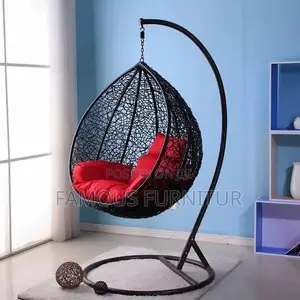 Modern Indoor/Outdoor Hanging Rattan Swing Chair With a Black Metal