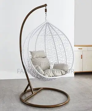 White Teardrop Hanging Egg Chair With an Intricate Woven Basket Design