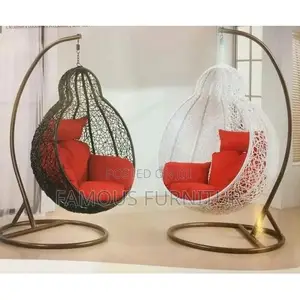 The Image Shows a Pair of Teardrop-Shaped Rattan Hanging Swing Chairs
