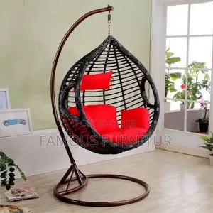 The Image Shows a Black Teardrop-Shaped Hanging Rattan Swing Chair