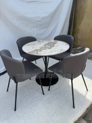 Contemporary Round Dining Set Featuring a Marbled Tabletop