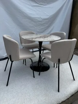 Contemporary Round Dining Set Featuring a Marbled Tabletop