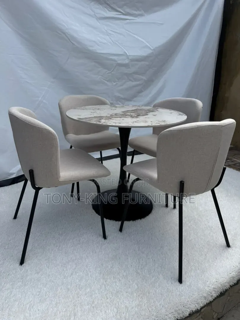 Contemporary Round Dining Set Featuring a Marbled Tabletop