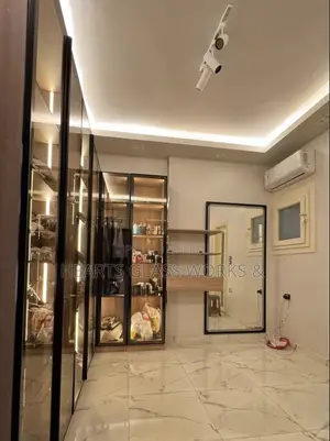 Beautiful Closet With Frame Glass Doors