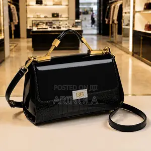 A Deep Glossy Burgundy and Glossy Black Bag