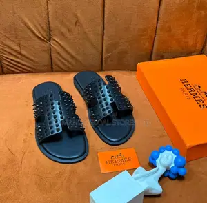 Hermès Spiked "H" Cutout Slide Sandals in Black