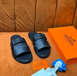Hermès Double-Band Pebble-Leather Sandals in Black