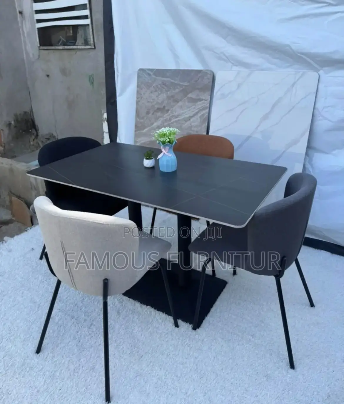 Modern Dining Set Featuring a Dark, Grid-Patterned Ceramic or Stone-
