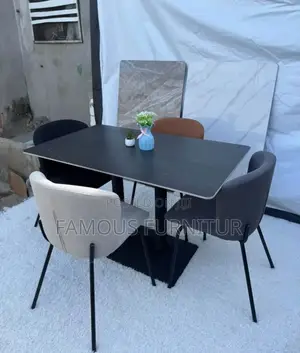 Modern Dining Set Featuring a Dark, Grid-Patterned Ceramic or Stone-