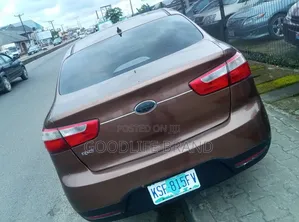 Kia Rio LX 4dr Sedan (1.6L 4cyl 6M) 2014 Brown
