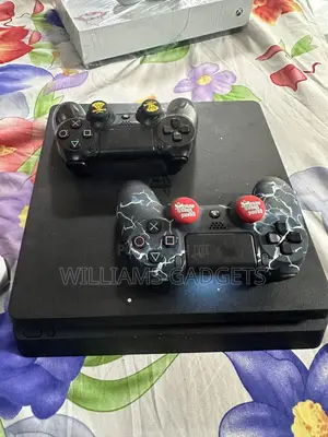 Ps4 Slim With Two Original Controllers and One Free Normal Controller