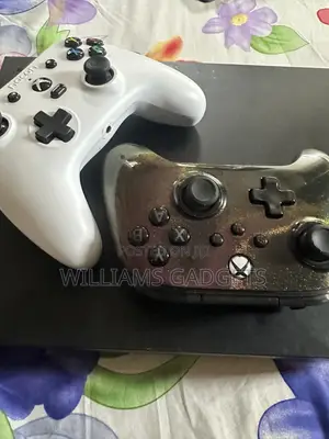 Xbox One X, Two Wired Controllers and Games Installed