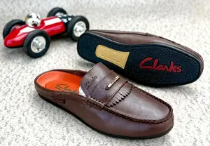 Clarks Leather Kiltie Fringe Slip-on Mules in Brown