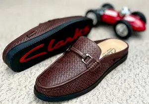 Clarks Woven-Texture Buckle Slip-on Mules in Brown