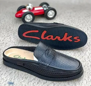 Clarks Hexagon-Texture Leather Slip-on Mules in Black