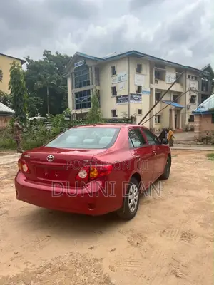 Toyota Corolla Base 4dr Sedan (1.8L 4cyl 5M) 2010 Red