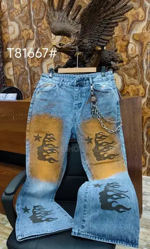 Black Washed Denim Jeans Featuring Paneled Knee Details and Embroider