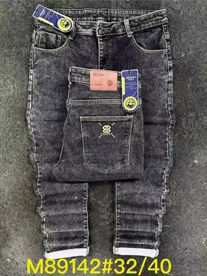 Men's Acid-Wash Ala Jeans Featuring a Striking Black and Yellow Speckl