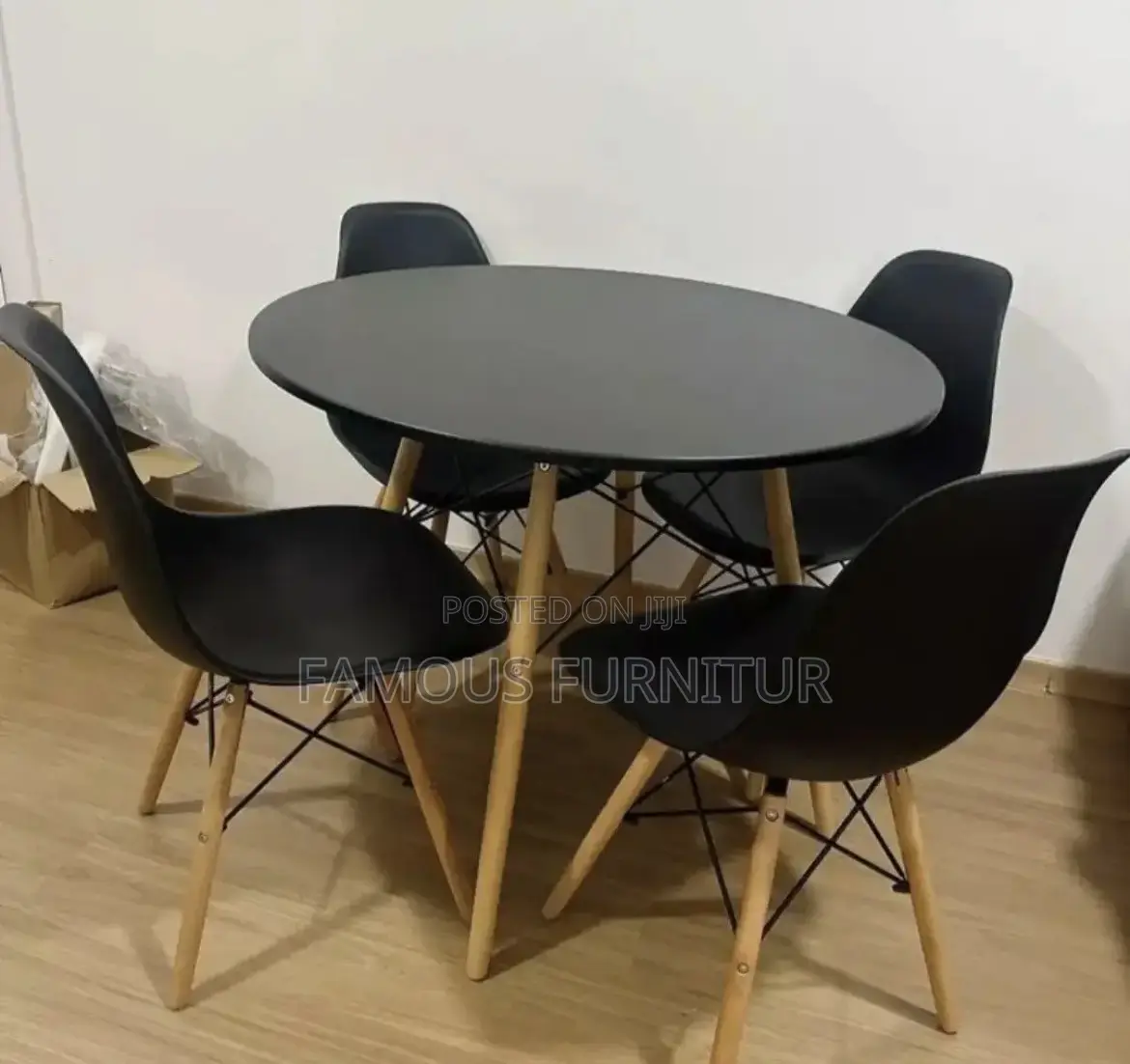 Modern Round Dining Set Featuring a Smooth Black Tabletop Paired