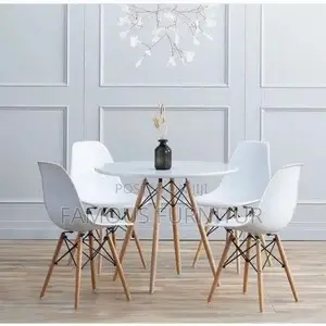 Modern Round Dining Set Featuring a Smooth Black Tabletop Paired