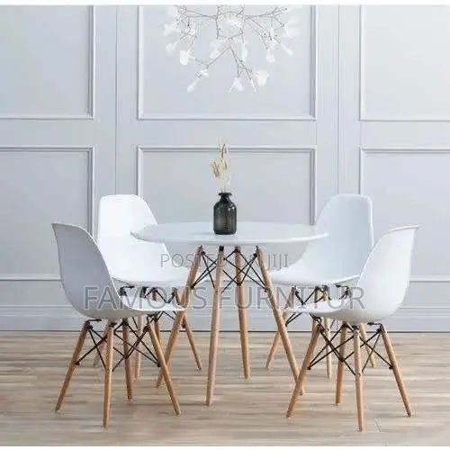 Modern Round Dining Set Featuring a Smooth Black Tabletop Paired