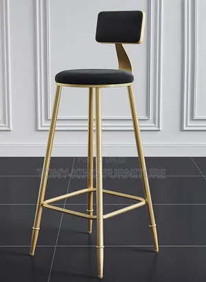 Modern Minimalist Gold Bar Stool Features a Sleek Metallic Frame.