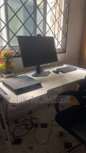 Complete Gaming Workstation Setup: PS4 Slim, AOC Monitor, Desk