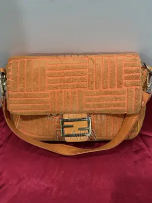 Stylish Orange Textured Baguette Bag With Gold Buckle Accent