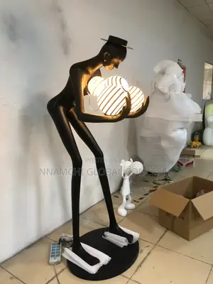 Humanoid Art Sculpture Holding Ball LED Floor Lamp Postmodern Designer