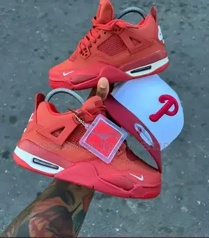 Air Jordan 4 RM "Brick Red" Sneakers