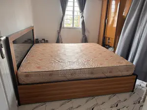 Bed and Bed Frame, Center Table and Standing Fan