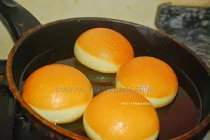 A Box of 6 Sugar or Jam Donuts