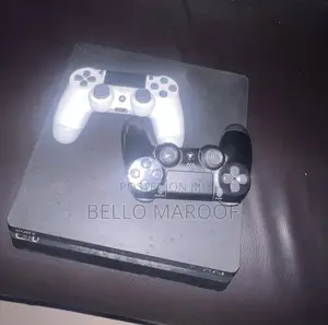 PS4 SLIM With 2 Original Controllers. 2 Game CDs.