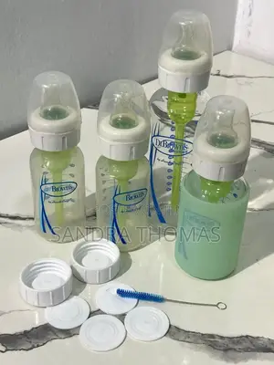 Plastic and Glass Feeding Bottles With Caps