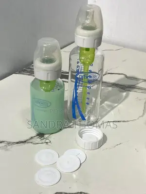 Plastic and Glass Feeding Bottles With Caps