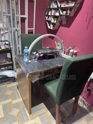 A Pair of Office Chairs and Table
