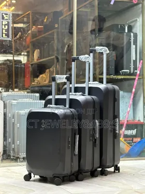 Hardside Trolley Suitcases With Telescoping Handles and Spinner Wheels