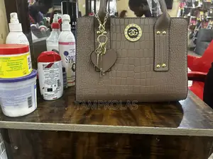 Title: Elegant Brown Croc-Embossed Ladies Handbag With Gold Detailing