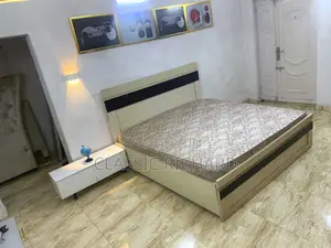 Bedframe and Mattress and White TV Console