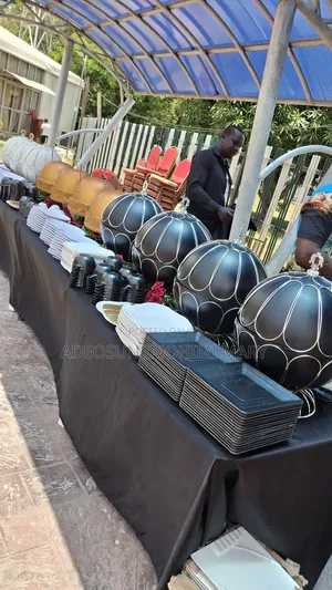 Beautiful Buffet Setup With Well-Groomed Waiters and Waitresses.