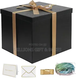 Black Birthday Packages Boxes With Golden Ribbons.