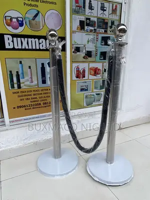 Crownd Stanchion Barriers With Black Rope
