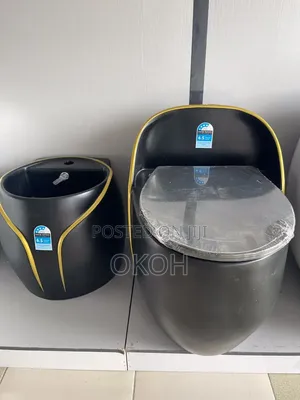 Egg-Shaped Black and Gold Water Closet