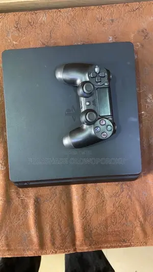 Play Station 4 (PS4) Slim + 1 Controller 6-8games + FC26 Package